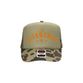 The front of a Green Trucker hat with "The HIGHWOMEN" and a camo colored brim.  